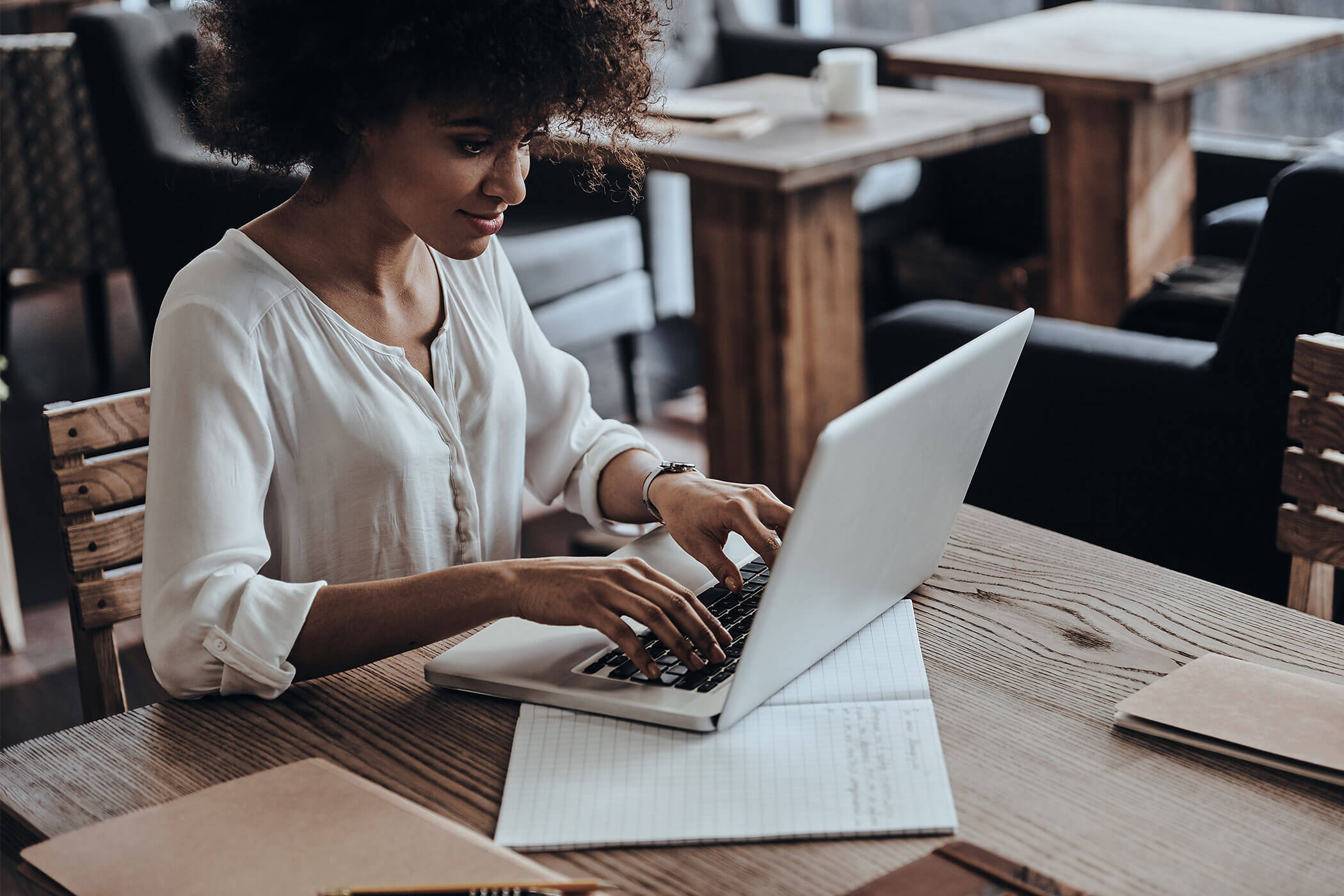 Woman Using Laptop in Office