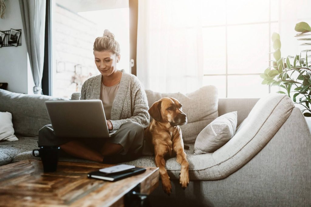 Woman At Home With Dog