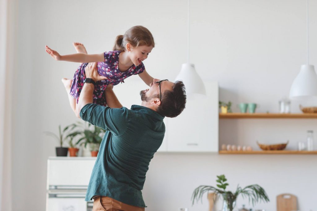 Father Lifting Up Daughter