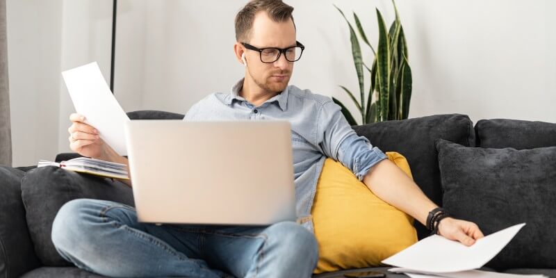 Man Doing Paperwork At Home