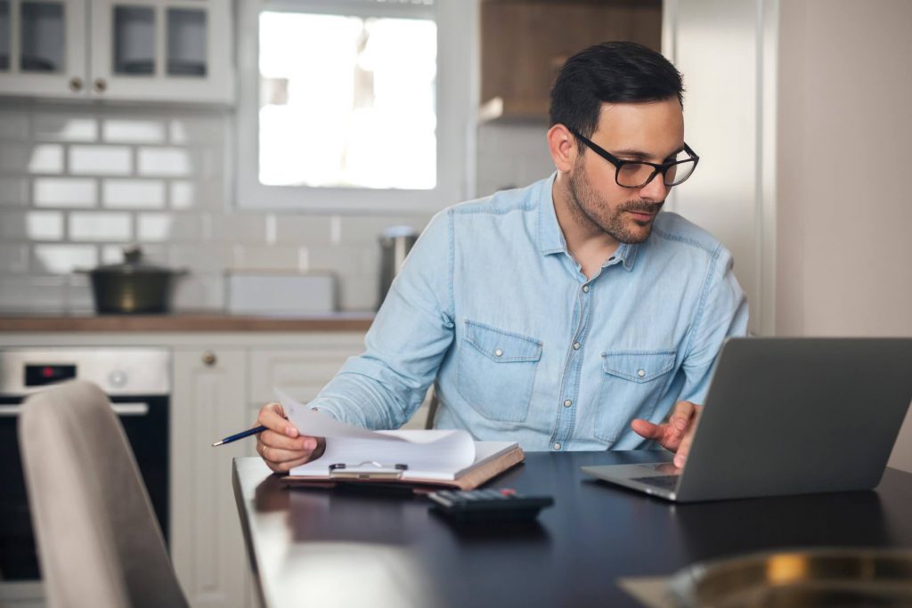 Man Doing Paperwork Online