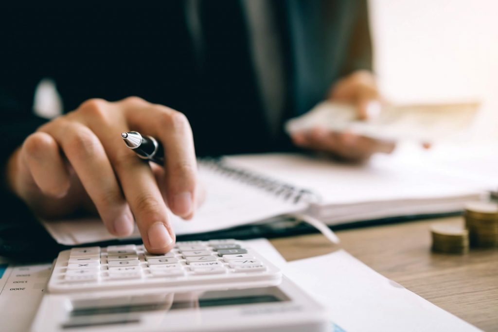 Woman Using Calculator