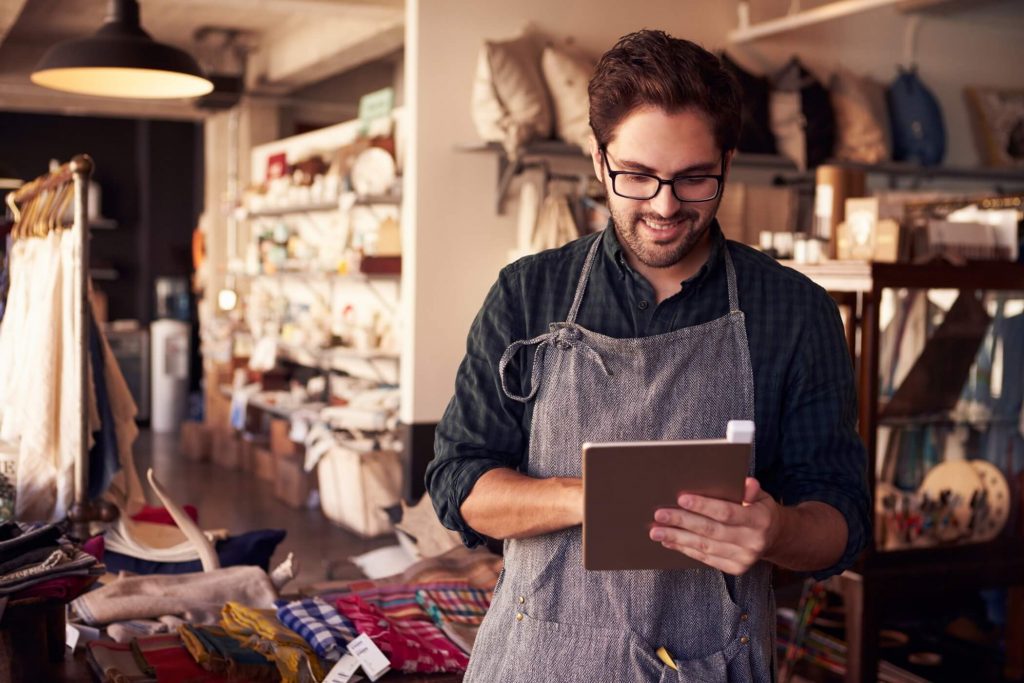 Business Owner On Tablet