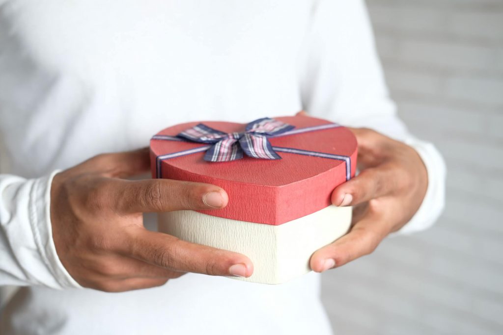 Holding Heart Shaped Gift