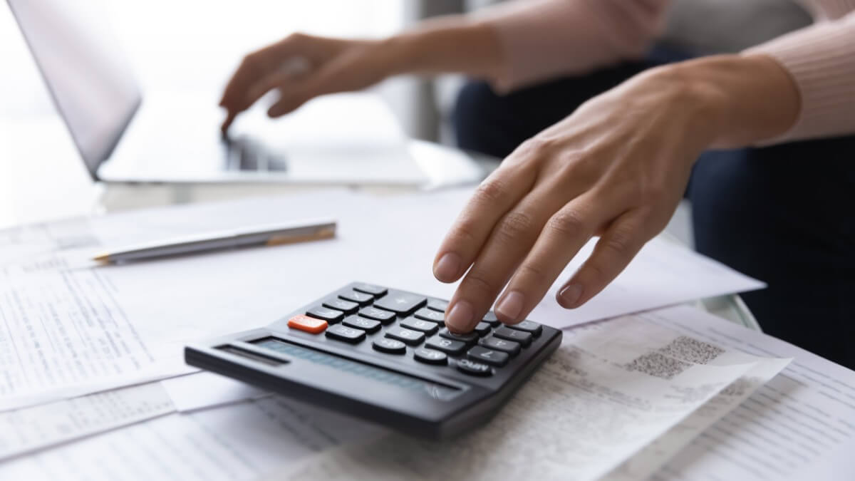 Woman Using Calculator