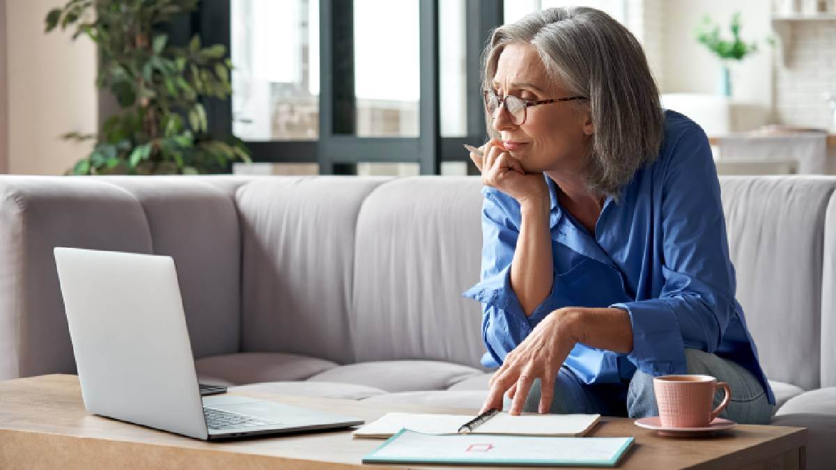 Middle Aged Woman Doing Paperwork