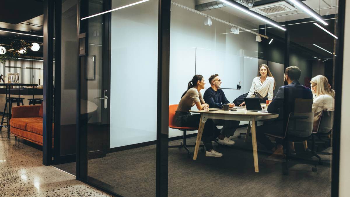 Colleagues In Meeting Room