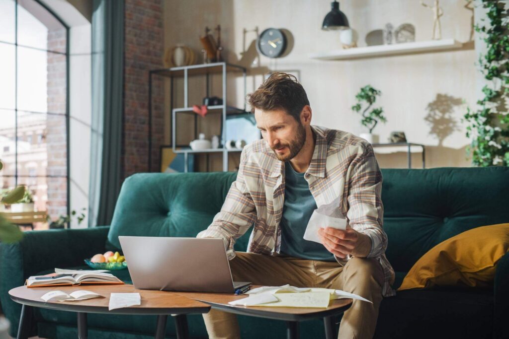 Man Doing Paperwork At Home