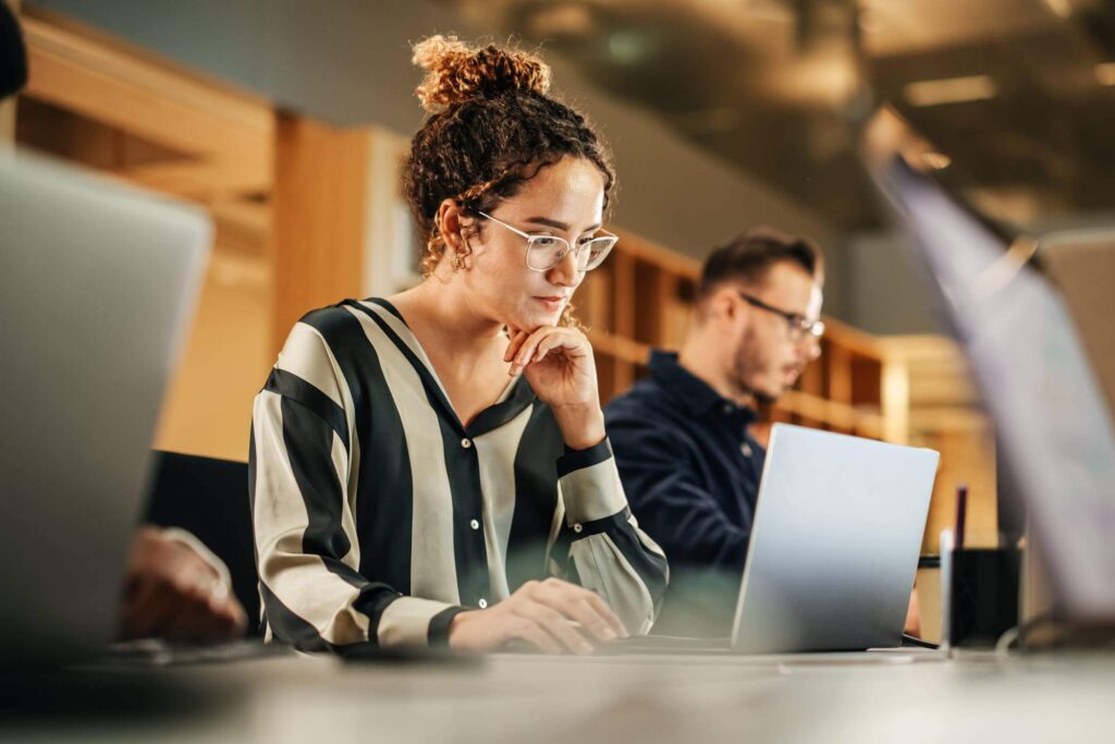 Young Woman Working In Library