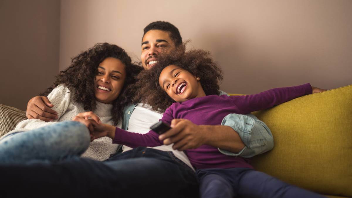 Family Relaxing On Sofa