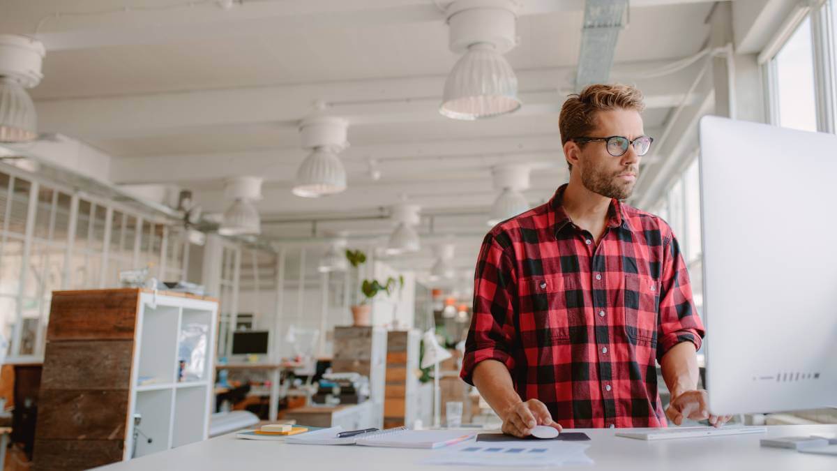 Male Business Owner On Computer