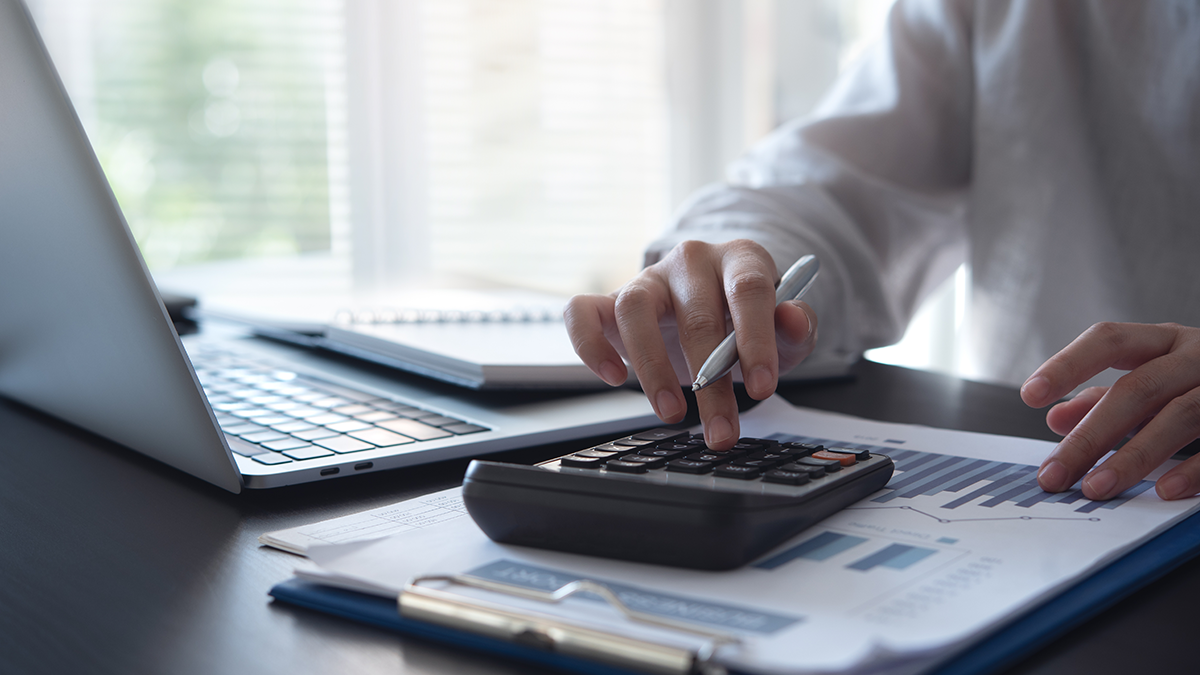 A man calculating with a calculator