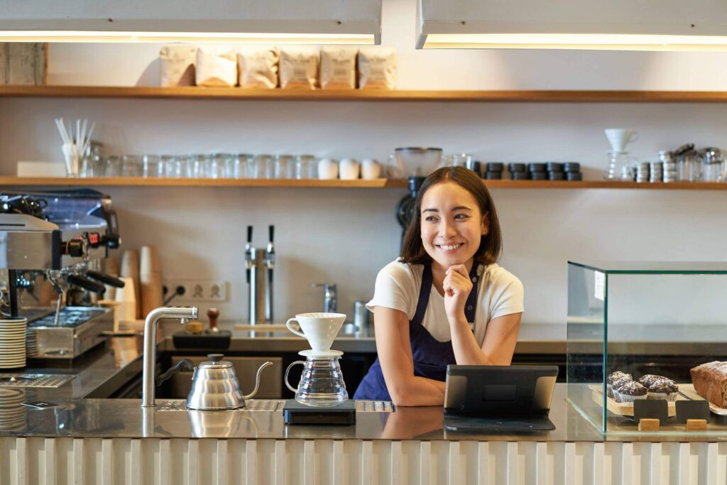 Cafe owner smiling