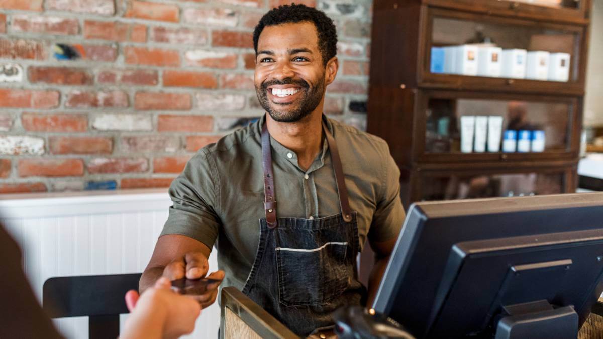 Shop owner smiling