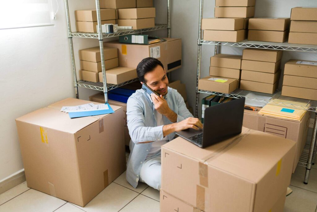 Business owner on phone and laptop